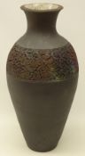 Raku fired vase of baluster form, with textured applied panel and crackle glaze interior,