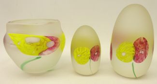 Dan Aston Firefly studio frosted glass bowl and two paperweights, all decorated with flowers,