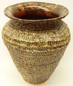 Textured stoneware vase with brown glaze, indistinctly signed in pencil, C.