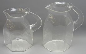 Pair graduating studio glass pitchers by Steven Newell,