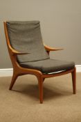 1970s teak framed armchair on tapering supports, upholstered loose cushions,
