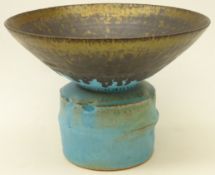 Studio pottery footed vase decorated with turquoise and bronzed manganese rim,