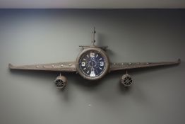 Modern wall clock in the form of an aeroplane,