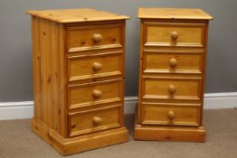 Pair of solid pine four drawer pedestal chests with turned handles.