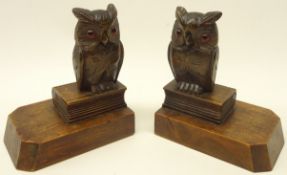 Pair of Black Forest bookends carved as owls perched on a book,