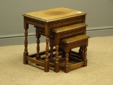 Medium oak nest of three rectangular tables, carved side rails, on turned supports, 51cm x 35cm,