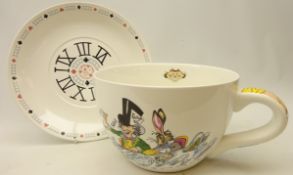 Large cup and saucer with 'Alice in Wonderland' design by Paul Cardew,