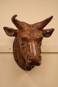 Large cast metal wall hanging bust of a bull,