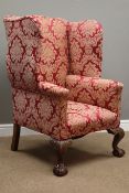 Queen Anne style wingback armchair, walnut framed, upholstered in Damask fabric,