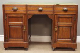 Edwardian walnut twin pedestal desk, three drawers and two panelled cupboards, W119cm, H77cm,