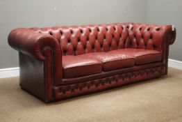 Three seat Chesterfield sofa upholstered in oxblood red buttoned leather (W204cm),