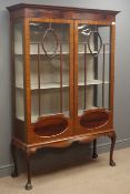 Edwardian mahogany display cabinet, projecting cornice above two astragal glazed doors,