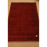 Afghan red and blue ground rug, Herati decorated field with repeating border,