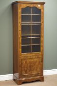Mid 20th century walnut display cabinet, glazed above panelled cupboards, W60cm, H165cm,