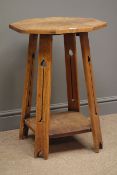 Arts & Crafts oak side table, octagonal top, four pierced supports with under tier, D51cm,