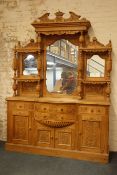 Large Victorian style waxed pine mirror back sideboard, carved pediment,