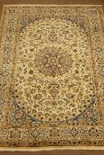 Fine Persian Nain ivory ground carpet, central medallion with scroll decorated field,