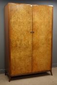 Mid 20th century walnut double wardrobe, two figured doors enclosing handing space and shelf,