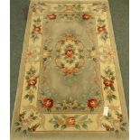 Chinese pale blue ground washed woollen hearth rug,