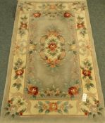 Chinese pale blue ground washed woollen hearth rug,