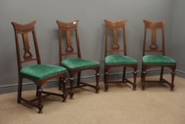 Four Art Nouveau walnut chairs, pierced cresting rail and splat,