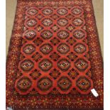 Fine Turkoman red ground rug, decorated with Guls,
