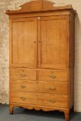 19th century oak linen press cupboard on chest, two panelled doors enclosing shelves,