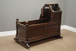 Early 18th century oak crib with canopy, fielded panelled sides, front and back, L110cm,