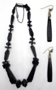 Jet bead necklace and a pair of onyx and amethyst silver ear-rings,