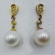 Pair of 9ct gold pearl and diamond pendant ear-rings stamped 375 Condition Report