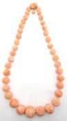 Carved Chinese coral bead necklace,