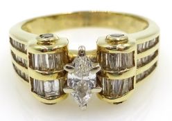 Baguette and central marquise cut diamond, gold scroll ring,