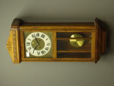 Early 20th century stained beech wall clock, twin train movement,