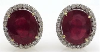 Pair of 18ct white gold ruby and diamond cluster stud ear-rings, rubies stamped 750,