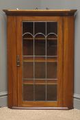 Edwardian mahogany hanging corner cabinet, projecting cornice, hinged lead glazed door with lock,
