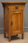 Arts and Crafts style walnut bedside cabinet, single drawer, one panelled door with metal handles,