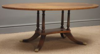Reproduction figured mahogany oval coffee table with brass inlay,