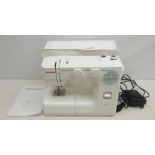 Janome 217-S electric sewing machine with instructions,