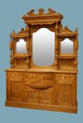 Large Victorian style waxed pine mirror back sideboard, carved pediment,