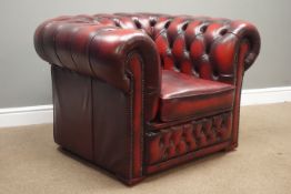 Chesterfield club armchair upholstered in deeply buttoned ox blood leather, W105cm,