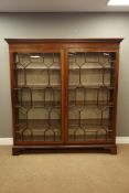 Large Georgian mahogany free standing bookcase, projecting cornice with dentil detail,