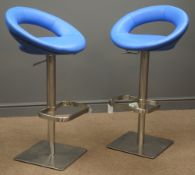 Pair of two contemporary adjustable swivel stools, upholstered in blue leather with lower back rest,