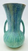 Art Deco two handled pottery vase, with streaked and mottled blue glaze, stamped 21,