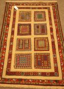 Small Persian rug, geometric design tiles with raised woollen borders,