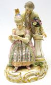 Late 19th/early 20th century meissen figure group of a seated lady reading a letter with a