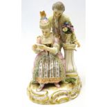 Late 19th/early 20th century meissen figure group of a seated lady reading a letter with a