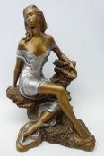 Bronzed model of a seated maiden by Austin Sculpture, copyright 1990, signed 'Alice Heath',