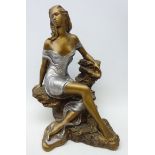 Bronzed model of a seated maiden by Austin Sculpture, copyright 1990, signed 'Alice Heath',