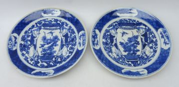 Pair early 20th century Chinese plates, decorated with two figures carrying a vase,