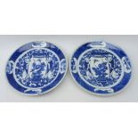 Pair early 20th century Chinese plates, decorated with two figures carrying a vase,
